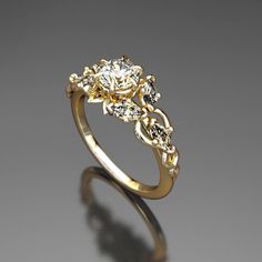 a yellow gold ring with diamonds on it