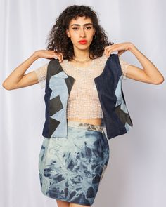 This reversible vest made from upcycled denim has a full and patched look, or an indigo dyed silk and denim patched pocket. A versatile, one of a kind luxury vest. Details * 1-of-1 * Hand-dyed, color-removed, upcycled patched denim * Reversible vest * Hand-dyed indigo shibori silk * Dry clean only *DUE TO THE NATURE OF OUR ITEMS BEING 100% HAND-DYED & MADE-TO-ORDER, THERE MAY BE SLIGHT VARIATIONS FROM ONE ITEM TO THE NEXT. Patchwork Denim Sleeveless Vest, Blue Denim Patchwork Top For Summer, Blue Recycled Denim Vest For Spring, Summer Blue Patchwork Denim Top, Sleeveless Patchwork Denim Vest, Spring Blue Recycled Denim Vest, Blue Patchwork Sleeveless Vest, Sleeveless Patchwork Denim Vest For Summer, Summer Sleeveless Denim Vest With Patchwork