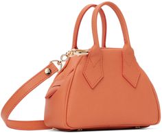 Saffiano faux-leather top handle bag in orange. · Rolled carry handles · Adjustable and detachable crossbody strap · Logo hardware at face · Bumper studs at base · Zip closure · Card slot at interior · Twill lining · Logo-engraved gold-tone hardware · H4.5 x W6.5 x D3 Supplier color: Orange Orange Rolls, Faux Leather Top, Handle Bag, Vivienne Westwood, Crossbody Strap, Leather Top, Travel Luggage, Color Orange, Luggage Bags