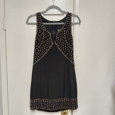 This Incredible Dress Is Sure To Turn Heads At Your Nye Party, Or Any Party Where You Want To Make A Statement! Originally $1,495, In Great Pre-Owned Condition No Major Signs Of Wear Heavily Studded Heavy Dress 100% Silk Shift Fit Sleeveless Zip Back Closure Description Sheri Bodell Silk Shift Dress Black Studded Accents Sleeveless With Scoop Neck Fit:Dresses By Sheri Bodell Typically Fit True To Size. Estimated Item Measurements Bust: 31.75" Waist: 29.5" Hip: 33.75" Length: 31.25" Fabric: 100% Heavy Dresses, Studded Dress, Silk Shift Dress, Shift Dress Black, Dress 100, Fitted Dress, Shift Dress, Black Silver, Scoop Neck