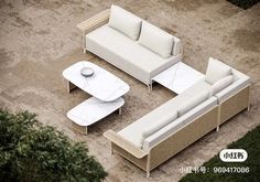 an aerial view of a living room with couches, tables and coffee table in the middle