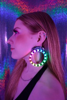 Looking for something to take your outfit to the next level? These are the perfect earrings for your next rave, festival, dance party, or night on the town! With 15 bright, sound-reactive patterns, long battery life, and no wires or battery pack to get in the way, these lightweight earrings will make you shine all night. With our sound-responsive technology, they are always in sync with the beat! Each earring has 15 super-bright multicolored LEDs, 15 patterns, and 5 brightness settings. You can Multicolor Punk Jewelry For Parties, Punk Multicolor Party Jewelry, Multicolor Rave Jewelry For Party, Festival Dance, Constellation Earrings, In Sync, Rave Festival, Laser Cut Acrylic, Lightweight Earrings