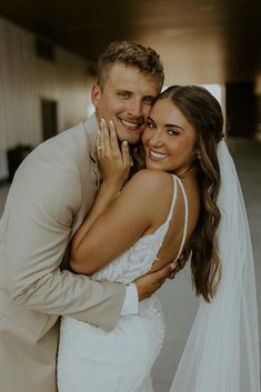 a bride and groom posing for a photo