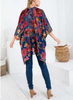 Light up the room in this colorful kimono. The material is lightweight and comfortable. This Kimono looks great with jeans or leggings. Just Toss on heels or sandals and you're good to go. 100% Viscose Hand wash cold Import Blue Kimono For Spring Day Out, Blue Floral Print Kimono For Fall, Casual Blue Kimono For Festival, Casual Blue Kimono For Day Out, Casual Blue One Size Kimono, Multicolor Print Kimono With Vibrant Print And Kimono Sleeves, Blue One-size Kimono For Spring, One Size Blue Floral Print Kimono, Spring Multicolor Vibrant Print Kimono