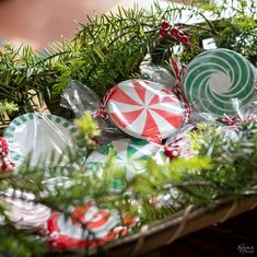 a basket filled with candy canes on top of a table