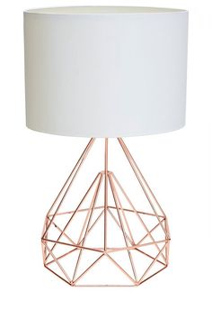 a table lamp with a white shade on the top and a pink wire frame around it