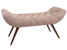 an upholstered bench with wooden legs and a beige fabric seat cover on it