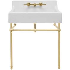 a white bathroom sink with gold fixtures on the sides and a golden faucet