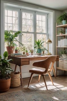 a home office with plants on the desk and bookshelves in front of large windows