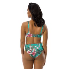 This bikini set for women showcases a vibrant Hawaiian floral print and is crafted from eco-friendly recycled fabrics. The bottoms have a cheeky cut while the high waist provides coverage. The bralette comes with removable padding and a v-scoop neck for a flattering look. • 81% REPREVE recycled polyester, 19% LYCRA XTRALIFE • 7.52 oz • Double-layered, non-reversible • Removable padding • Tear-away care label • Zig-zag stitching Tropical Style Green Swimwear For Pool, Green Tropical Underwire Swimwear, Tropical Green Underwire Swimwear, Tropical Turquoise Swimwear For Poolside, Hawaiian Floral Print, Hawaiian Hibiscus, Care Label, Recycled Fabric, Set For Women