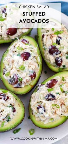 chicken salad stuffed avocados on a white plate