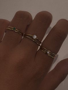 Product Description Truly a classic stacking ring that your ring collection can't live without! Featuring a tiny Emerald solitaire ring made with sparkly band and an even more sparkly cz gemstone. Crafted in 14k gold fill, it's comfortable and suitable for everyday wear. …………………………………. D E T A I L S • Available from US 5 to 8• Band width measures 1mm• 2mm cubic zirconia in emerald• Tarnish-resistant, waterproof, and safe for sensitive skin• 100% 14K Gold Filled• Build your ring stack and save up Everyday Ring Stack, Dainty Ring Stack, Emerald Solitaire Ring, Ring Stacks, Ring Stack, Ring Collection, Everyday Rings, Ring Stacking, Gold Ring Stack