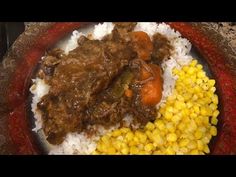 the meal is prepared and ready to be eaten on the plate with rice, corn