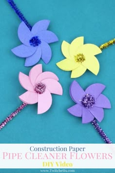 construction paper pipe cleaner flowers on a blue background with text overlay that says construction paper pipe cleaner flowers