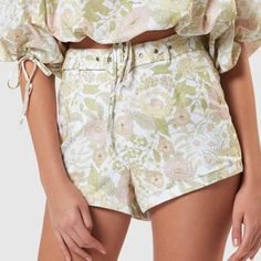 These Sweet Floral Shorts Are Super Cute With A White Singlet Top Or Matching Mila Blouse. Dress Them Up With Strappy Heels Or Slip On Your Slides And Head To The Beach. Length: Inside Leg: 5.5cm; Front Rise: 34.5cm; Leg Opening: 68cm (Size 8) Our Model Is 177cm (5’10”) Tall With An 81cm (32”) Bust, A 62cm (24”) Waist And 88cm (35”) Hips. - High-Waisted Tailored Shorts - Belt Loops With Belt Cold Machine Wash. Hang To Dry. Warm Iron. Material: 55% Linen 45% Cotton Feminine Beach Bottoms For Spring, Feminine Bottoms For Spring Vacation, Feminine Spring Vacation Bottoms, Feminine Summer Cotton Bottoms, Feminine Cotton Beach Shorts, Feminine Shorts For Spring Vacation, Feminine Short Length Bottoms For Beach, Feminine Short-length Beach Bottoms, Feminine Floral Print Short Bottoms