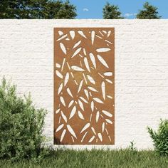 a painting on the side of a white brick wall