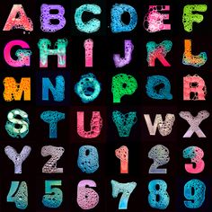 the letters and numbers are drawn with colored chalks on a black background in different colors