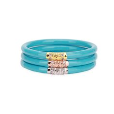 BuDhaGirl’s Three Kings All Weather Bangles® (AWB®) - Turquoise are beautiful orbs that hold all of our extraordinary qualities…they are weightless, soundless, waterproof, and TSA proof while being amazingly glamorous. Available in a set of 3 each in either coral, jade, black, ivory, or red they look stunning combined with our gold or silver AWB. Each set has our exclusive Lotus prayer bead in yellow gold, white gold, and rose gold…thus the name Three Kings, paying tribute to the three hues of g Bangle Box, Three Kings, Brown Dog, Denim Accessories, Monogrammed Items, Gold Medal, Gift Accessories, Accessories Rings, Silver Leaf