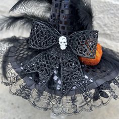 This black Witchy headpiece will take your Halloween outfit to the next level. It is an easy way to add a bit of spooky to you Halloween. *Locally hand made in New Orleans. Headpieces usually ship within 3-5 business days. Please be aware that due to the unique and handmade nature of each product, color, shapes, and sizes may vary slightly from the photo and descriptions. Gothic Black Costume Accessories As Gift, Halloween Novelty Mini Costume Hat, Handmade Costume Accessories For Halloween Masquerade, Black Themed Costume Accessories For Masquerade, Themed Black Costume Accessories For Masquerade, Adjustable Black Mini Hats For Cosplay, Gothic Black Mini Hats For Halloween, Spooky Halloween Costume Hats And Headpieces, Punk Mini Hats For Halloween Cosplay