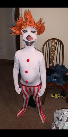 a creepy clown is standing in the living room