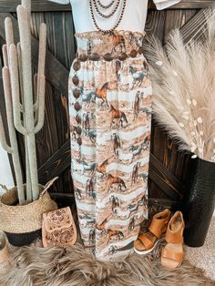 Horse graphic maxi skirt with smock elastic waist. Has a relaxed fit. Woven maxi skirt. Runs true to size with great stretch.  Material: 95% Polyester | 5% Spandex Small (2/4/6) | Medium (6/8/10) | Large (10/12/14) | XL (14/16/18)