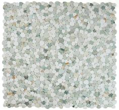 a white and green mosaic tile with small circles on the bottom, in various sizes