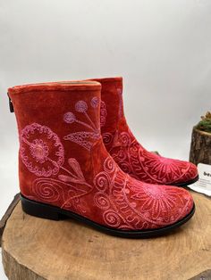 This is hand embroidery genuine leather custom made ankle boots.  Every size available.  There is 1 inches heel.  Round toe comfy shoes.  Custom made. İf you need wider calf measure please send us your calf measure from widest part.  Same boots but other style ( cowboy, platform etc. ) Please messages us.  Made with vintage suzani tapestry and genuine leather.   We have door to door express shipping.  İf you have any questions please contact with us.  bemyboots.etsy.com Thank You Red Bohemian Boots For Fall, Red Embroidered Winter Boots, Bohemian Red Leather Boots, Red Embroidered Boots With Round Toe, Embroidered Red Boots With Round Toe, Bohemian Leather Boots With Floral Embroidery, Bohemian Embroidered Boots With Round Toe, Bohemian Embroidered Round Toe Boots, Traditional Boots With Floral Embroidery And Round Toe