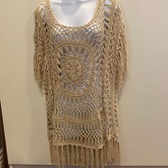 Tan Color M Handmade Design With Intricate Detail. Has The Same Design On Back. With Strong Dangles On Bottom And Sleeves. Beige Crochet Dress For Festival, Beige Knit Crochet Top For Beach, Summer Knit Tops With Fringe, Summer Knit Top With Fringe, Beige Crochet Dress With Crochet Trim For Festival, Beige Bohemian Open Knit Crochet Dress, Casual Crochet Dress For Festival, Bohemian Crochet Knit Top For Beach Cover-up, Cream Crochet Knit Top For Beach