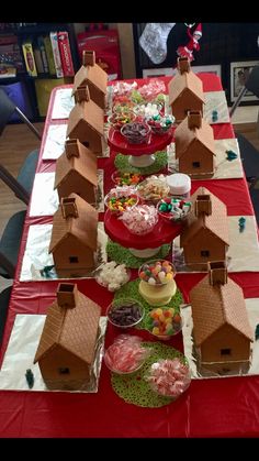 a table topped with lots of different types of foods and desserts on top of it