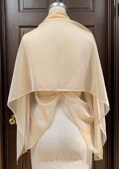 "Very light and airy shawl made out of iridescent chiffon. Easily draped and fixed with broach or tied at back to transform into shrug. Great shear cover up for top of your body. Poly chiffon prevent from wrinkles, easy to take care. Size of shawl does not overpowering with lots of fabric when wearing Size around 22\"x 60\" Fabric Champagne Iridescent Chiffon You have choices of broach: 1. Pearl flower 2. Pink Gold ornament" Evening Gown Cover Up Shawl, Formal Shawl, Blush Shoes, Ivory Wedding Gown, Evening Shawls, Chiffon Shawl, Scarf Outfit, B Fashion, Blush Bridal