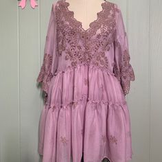 Please Note: This Dress Is A New Sample From The Free People Sample Sale. No Care Label Or Size Label Is Attached. It Is Not Yet Available In Store. Name Of Dress Is Chrysanthemums Mini. Size Listed As Xs But Could Fit A Small. Please See Measurements Below. Content: 100% Polyester Color: Lilac Rose Cream Comes With Slip Dress Tie Sleeve Babydoll Style Embroidered V Neck Tiered Ruffles Cinched Bell Embroidered Sleeve Measurements: Bust: 34” Length:32” Purple Lace Mini Dress For Spring, Bohemian Purple Mini Dress, Purple Bohemian Mini Dress, Purple Short Sleeve Dress With Lace Trim, Summer Lavender Lace Dress, Purple Flowy Mini Dress, Lavender Lace Dress For Summer, Embroidered Lace V-neck Mini Dress, Lace Mini Dress With Floral Embroidery And V-neck