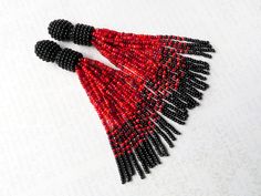 Red Beaded Dangle Earrings With Tassels, Red Beaded Tassel Drop Earrings, Elegant Red Beaded Earrings With Fringe, Elegant Red Beaded Fringe Earrings, Red Fringe Tassel Earrings With Round Beads, Red Beaded Fringe Tassel Earrings Gift, Red Beaded Earrings With Tassels And Round Beads, Red Tassel Earrings With Fringe And Round Beads, Fringe Earrings With Round Beads As Gift