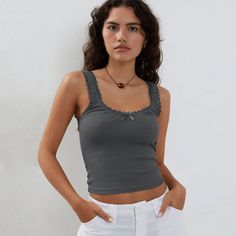 Experience the ultimate in sexy style with this slim-fit tank top made from comfortable jersey fabric. Featuring a solid pattern with lace, tulle, and fishnet elements, this crop top is versatile enough to pair with any bottom. The crew neckline adds a touch of sophistication, making it the perfect addition to your summer wardrobe. Made from high-quality polyester, it's the ultimate must-have for the season. Gray Fitted Tank Top With Built-in Bra, Lace Crop Top Tank With Lace Trim, Fitted Gray Tank Top With Built-in Bra, Lace Crop Top With Lace Trim, Fitted Lace Cami Crop Top, Trendy Fitted Tank Top With Lace Trim, Fitted Lace Trim Cami Crop Top, Lace Tank Top, Bra Friendly, Lace Tank Top Bra Friendly