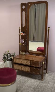 a dressing table with a mirror and stool