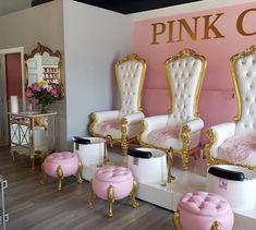 the pink chair salon is decorated in gold and white