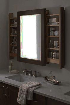 a bathroom with two sinks and a large mirror above the sink is shown in this image