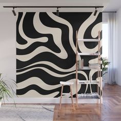 a black and white wall mural with wavy lines