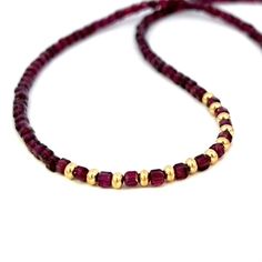 This gorgeous necklace is a blend of AAA quality, natural gemstone garnets. The beads are a deep red, juicy, berry color, similar to pomegranates and are extremely sparkly. These gorgeous garnets were discovered in Mozambique and have been expertly cut into unique cubes. The 14k gold filled chain is adjustable from approximately 17”-19” and has a 14k gold filled lobster clasp. The garnet beads are 3 mm. This necklace is quite luxe looking due to the beautiful beads and large amount of 14k gold i Affordable Red Beaded Chain, Garnet Gemstone Necklace With Round Beads, Garnet Gemstone Beads Necklace, Garnet Necklaces With Faceted Beads For Gifts, Garnet Round Bead Necklace For Gift, Garnet Bead Necklaces For Gifts, Garnet Beaded Necklaces As Gift, Garnet Round Beads Necklace For Gift, Elegant Ruby Beads As Gift