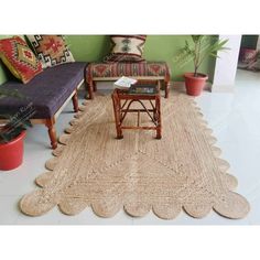 a living room with two couches and a rug on the floor in front of it