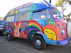 a colorful bus is parked in a parking lot