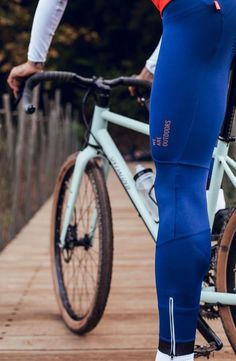 a person riding a bike on a wooden walkway