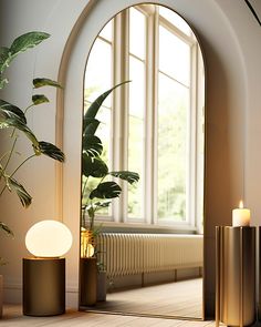 a room with a large window and some plants