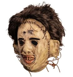 a creepy mask with hair on top of it