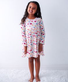 This dreamy dress is made to make any toddler twirl with joy! Soft bamboo fabric and long sleeves keep them comfy and stylish while they explore, frolic, and flutter through their day! Who said playtime has to be boring? 93% Bamboo and 7% spandex Wash cold with like colors; stays soft wash after wash Long Sleeve Twirl Ready Playful Spring Twirl Dress For Playdate, Playful Cotton Loungewear Dress, Comfortable Casual Twirl Dress For Playtime, Flowy Casual Twirl Dress For Playtime, Casual Flowy Twirl Dress For Playtime, Playful Ruffled Dress For Sleepovers, Playful Long Sleeve Dresses For Playwear, Playful Long Sleeve Playwear Dresses, Playful Ruffle Twirl Dress For Playwear