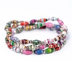 multicolored glass beaded bracelets on white background