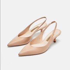 Genuine Zara New With Tag Material: Leather Upper Color: Nude Beautiful Nude Color..... Comfortable 1.9 Inch Heel... Great For Office Or With A Pretty Dress.. Euro Size 38 (7.5), 41(10) Beige Pointed Toe Slingback Pumps With 4-inch Heel, Beige Pointed Toe Sandals With 4-inch Heel, Feminine Beige Slingback Pumps For Formal, Feminine Beige Slingback Pumps For Formal Occasions, Cream Leather Kitten Heels For Spring, Spring Cream Leather Kitten Heels, Elegant Beige Slingback Pumps With Padded Heel, Beige Leather Kitten Heels With Closed Toe, Cream Slingback Pumps With Heel Strap For Work