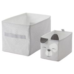 two storage bins, one with a dog face on the front and one with a bow