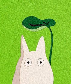 a white cat with a green plant in its mouth on a green background that says hello kitty