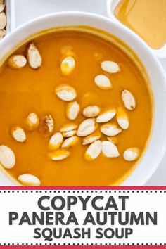 an overhead view of a bowl of soup with cashews in it and the words copycat panera autumn squash soup