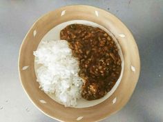 a bowl filled with rice and other food items